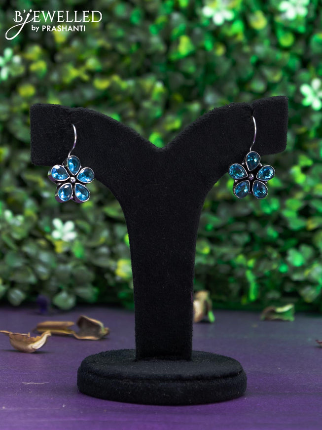 Oxidised hanging type earring with ice blue stones