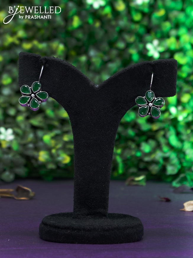 Oxidised hanging type earring with emerald stones