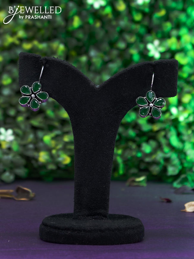 Oxidised hanging type earring with emerald stones