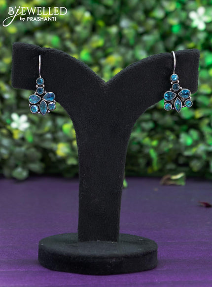 Oxidised hanging type earring with ice blue stones