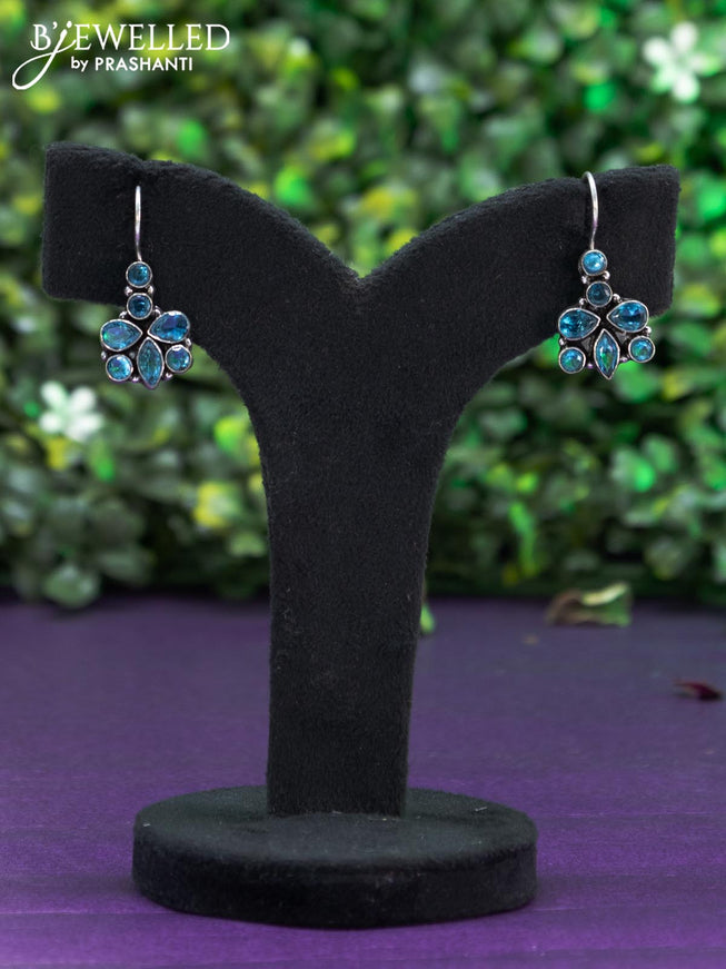 Oxidised hanging type earring with ice blue stones