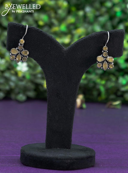 Oxidised hanging type earring with yellow stones