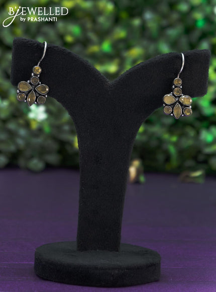 Oxidised hanging type earring with yellow stones