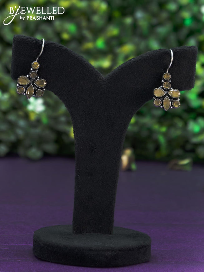 Oxidised hanging type earring with yellow stones