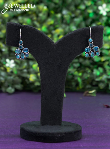 Oxidised hanging type earring with ice blue stones