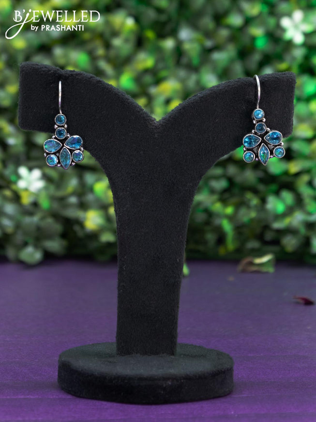 Oxidised hanging type earring with ice blue stones