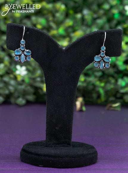 Oxidised hanging type earring with ice blue stones