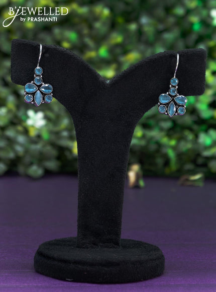 Oxidised hanging type earring with ice blue stones