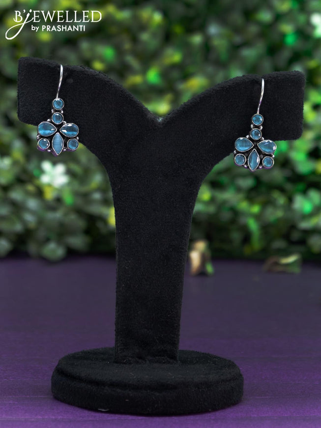 Oxidised hanging type earring with ice blue stones