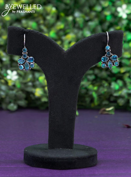 Oxidised hanging type earring with ice blue stones