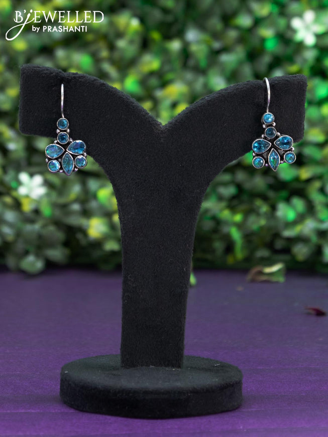 Oxidised hanging type earring with ice blue stones