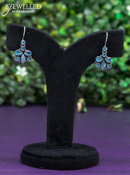 Oxidised hanging type earring with ice blue stones