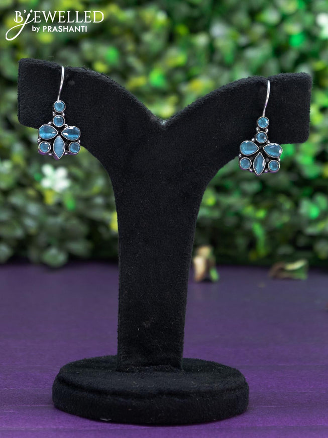 Oxidised hanging type earring with ice blue stones