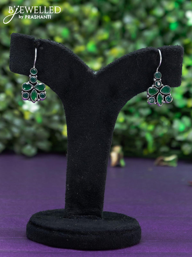 Oxidised hanging type earring with emerald stones