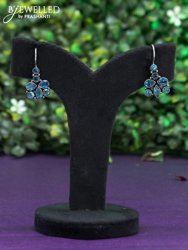 Oxidised hanging type earring with ice blue stones