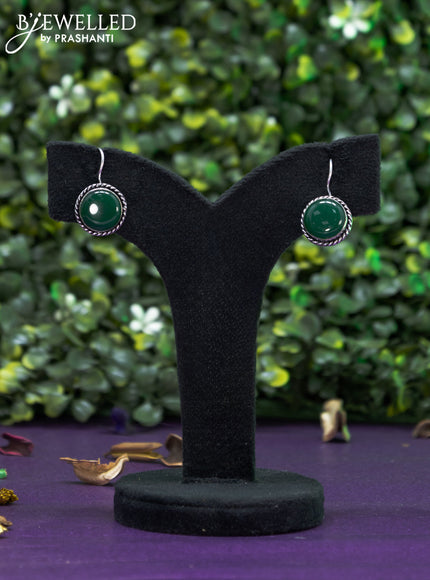 Oxidised hanging type earring with emerald stones