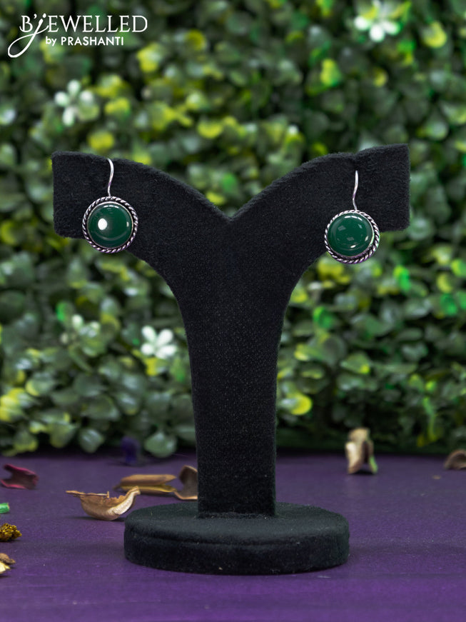 Oxidised hanging type earring with emerald stones