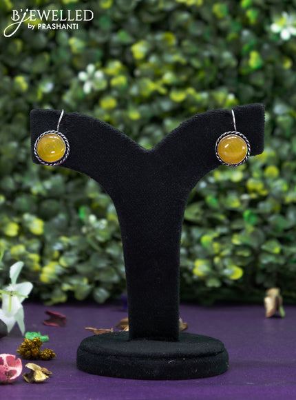 Oxidised hanging type earring  with yellow stones