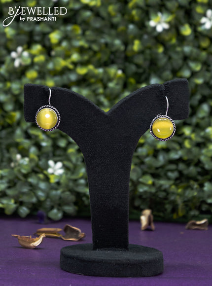 Oxidised hanging type earring  with yellow stones