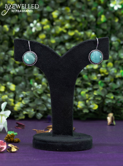 Oxidised hanging type earring with mint green stones