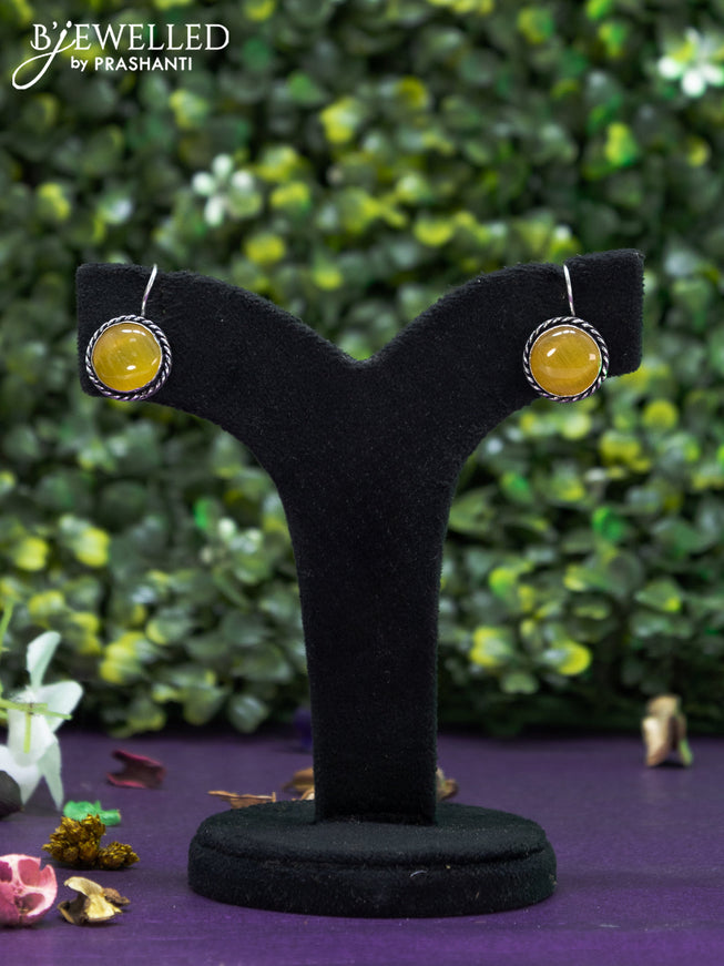 Oxidised hanging type earring  with yellow stones