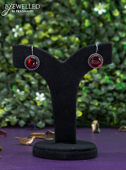 Oxidised hanging type earring with maroon stones