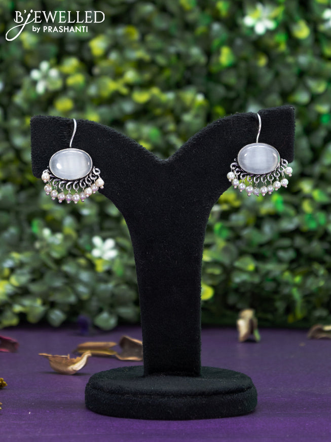 Oxidised hanging type earring with grey stones and pearl hanging