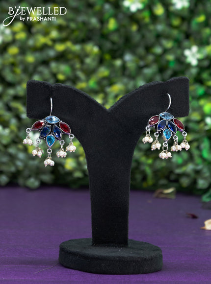 Oxidised hanging type earring with multi colour stones and pearl hanhing