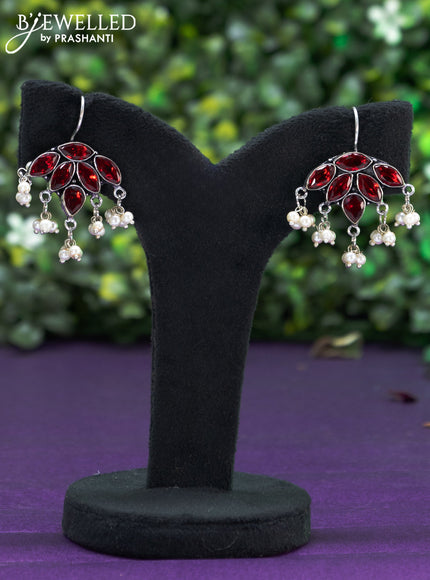 Oxidised hanging type earring with maroon stones and pearl hanhing