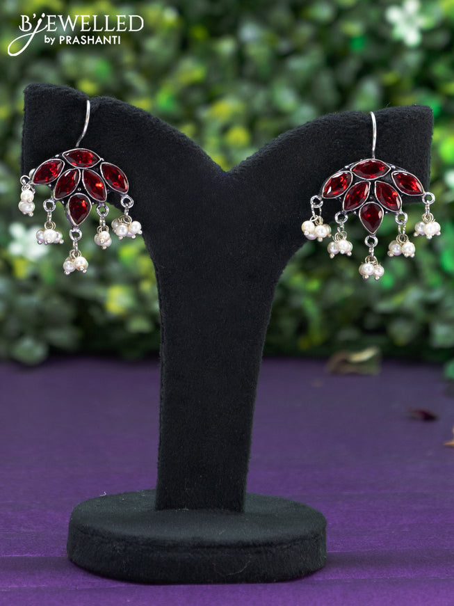 Oxidised hanging type earring with maroon stones and pearl hanhing