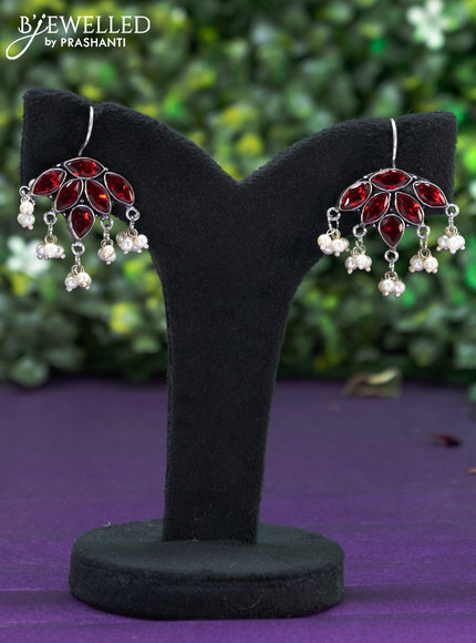 Oxidised hanging type earring with maroon stones and pearl hanhing