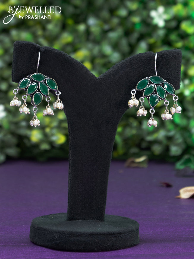 Oxidised hanging type earring with emerald stones and pearl hanhing