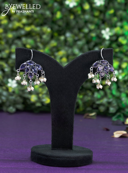 Oxidised hanging type earring with violet stones and pearl hanhing