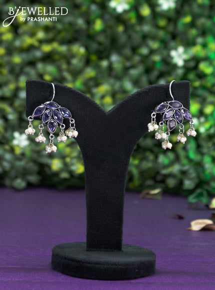 Oxidised hanging type earring with violet stones and pearl hanhing