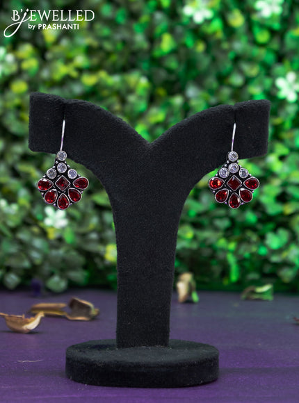 Oxidised hanging type earring with maroon and cz stones