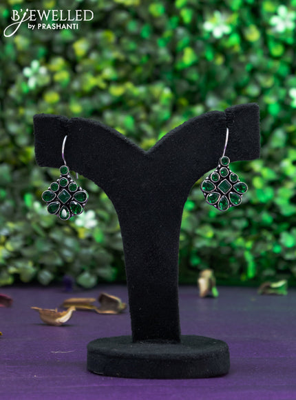 Oxidised hanging type earring with emerald stones