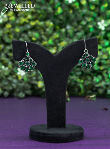 Oxidised hanging type earring with emerald stones