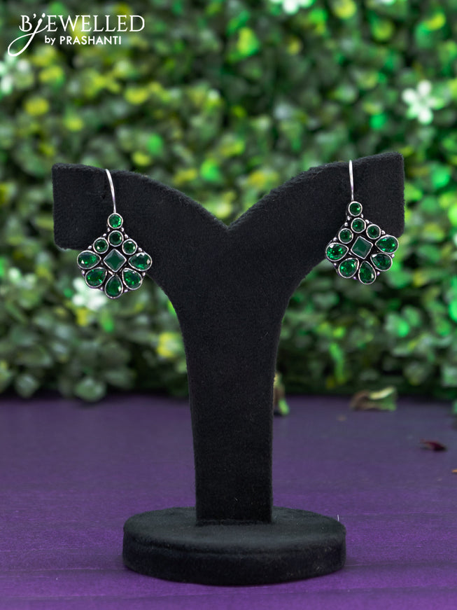 Oxidised hanging type earring with emerald stones