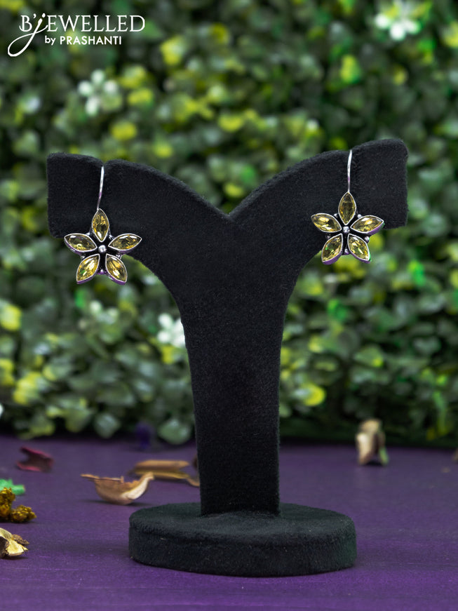 Oxidised hanging type earring floral design with yelllow stones