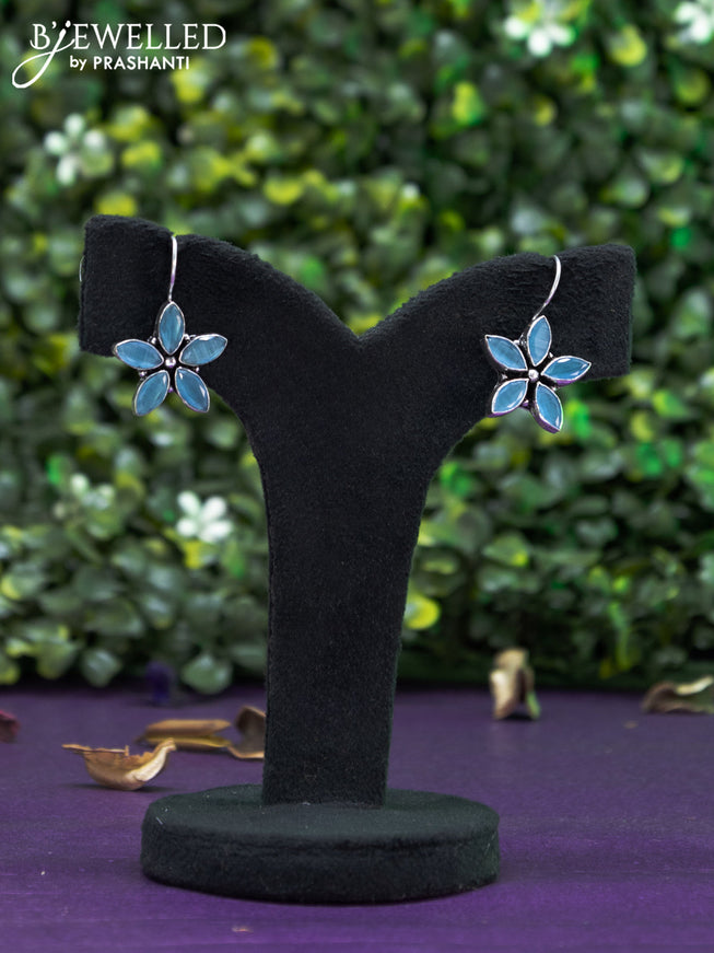 Oxidised hanging type earring floral design with ice blue stones