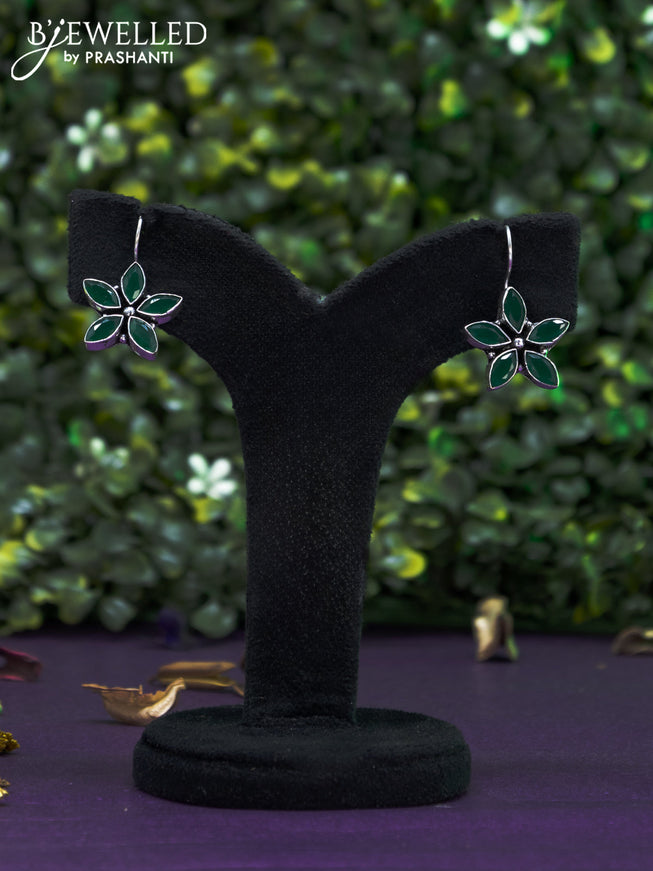 Oxidised hanging type earring floral design with emerald stones