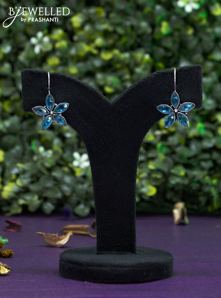 Oxidised hanging type earring floral design with ice blue stones