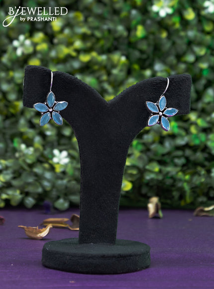 Oxidised hanging type earring floral design with ice blue stones