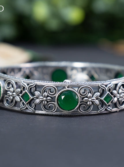 Oxidised screw type bangle with emerald stones