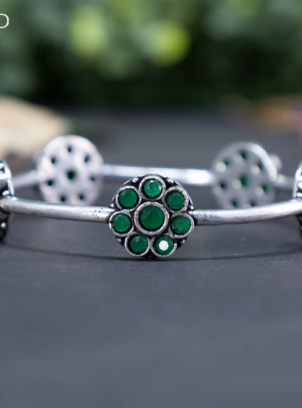 Oxidised floral design bangle with emerald stones