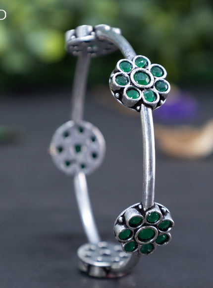 Oxidised floral design bangle with emerald stones