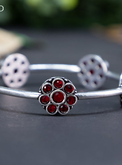 Oxidised floral design bangle with maroon stones