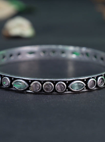 Oxidised bangle with mint green and baby pink stones