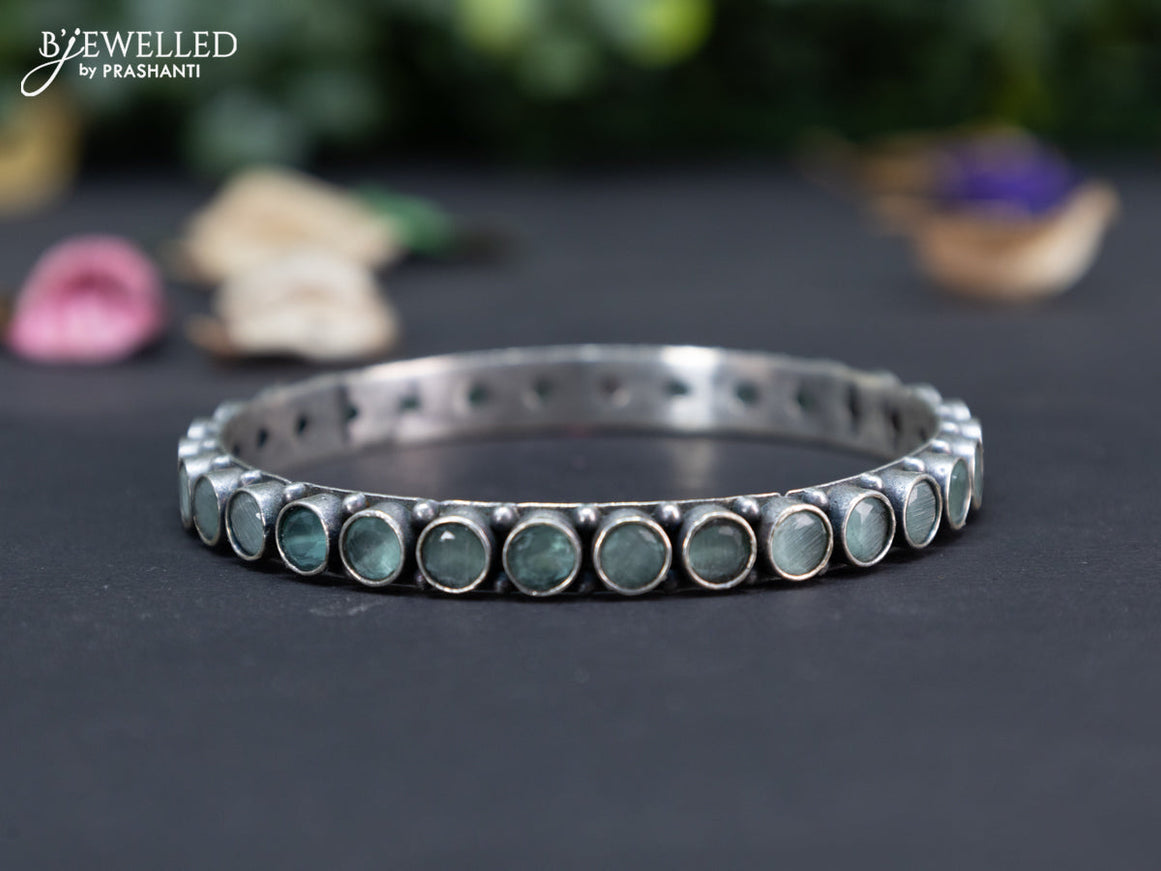 Oxidised bangle with mint green stones