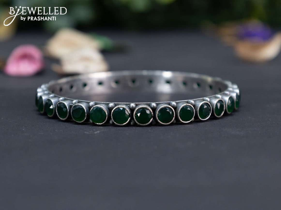 Oxidised bangle with emerald stones